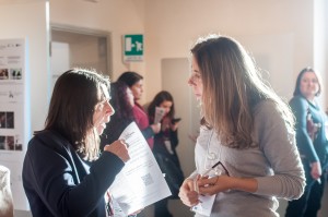 Antonella Fresa distributes the Questionnaire leaflet during a pause of the meeting.